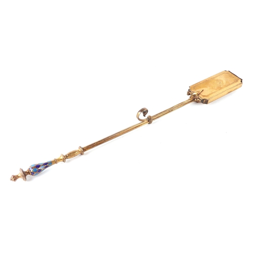 407 - A 19th century gilt metal ember tong with dark and light blue enamelled pommel handle, 56cms long.