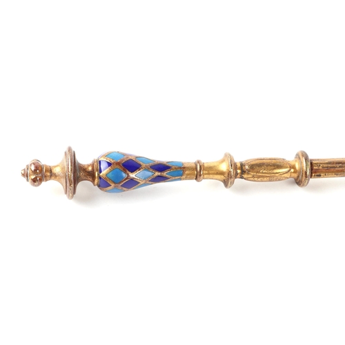 407 - A 19th century gilt metal ember tong with dark and light blue enamelled pommel handle, 56cms long.