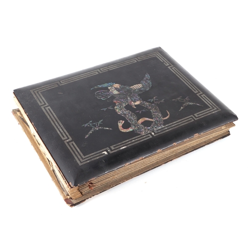 41 - An early 20th century Asian lacquer postcard album containing hand painted Japanese postcards and sc... 