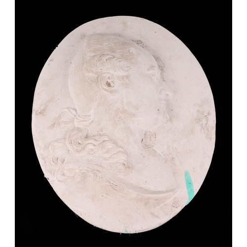 422 - A large plaster plaque decorated in high relief depicting a profile bust of a classical gentleman, 4... 