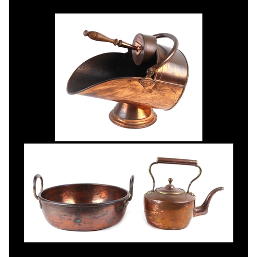 429 - A Victorian copper coal scuttle; together with a copper two-handled pan and a copper kettle (3).