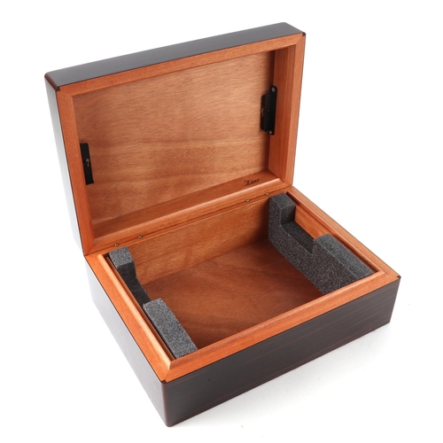 438 - A Davidoff Zino coromandel humidor, 31cms wide, with original instructions and silk lined box.