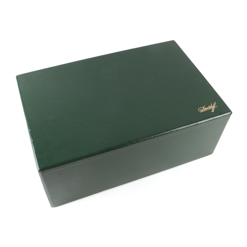 438 - A Davidoff Zino coromandel humidor, 31cms wide, with original instructions and silk lined box.