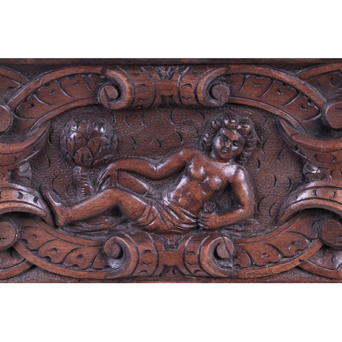 442 - A late 17th / early 18th century carved walnut panel depicting a figure within a cartouche, 53 by 28... 