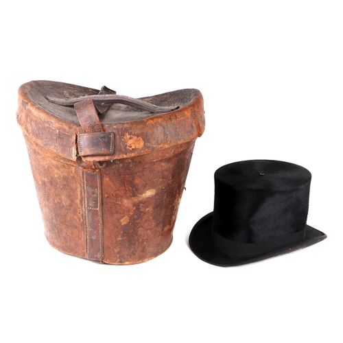 446 - A Victorian leather double top hat case with a single silk top hat, 38cms diameter.Condition ReportT... 