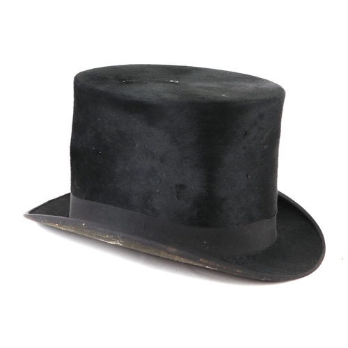 446 - A Victorian leather double top hat case with a single silk top hat, 38cms diameter.Condition ReportT... 