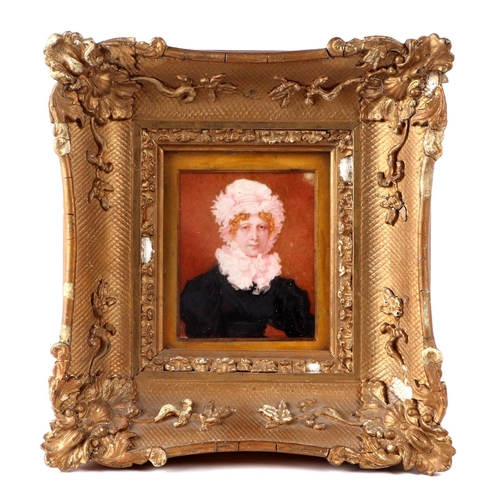 461 - A Victorian portrait miniature on ivory depicting a lady wearing a white bonnet and ruff, watercolou... 