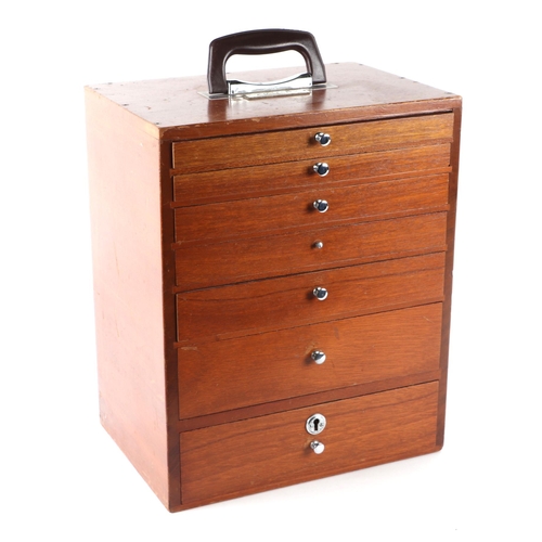 469 - A dentists table top seven-drawer graduated chest containing a selection of dental  instruments, 33c... 