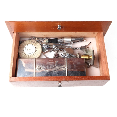 469 - A dentists table top seven-drawer graduated chest containing a selection of dental  instruments, 33c... 