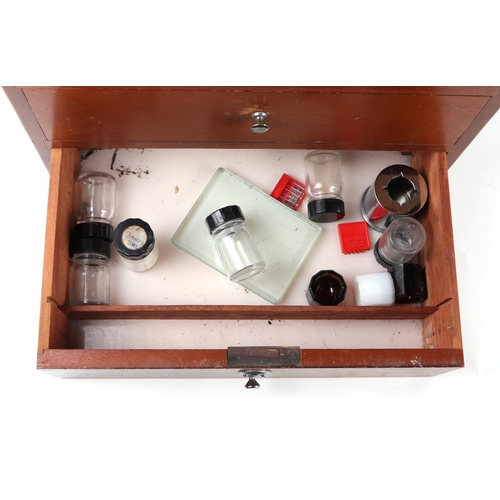 469 - A dentists table top seven-drawer graduated chest containing a selection of dental  instruments, 33c... 