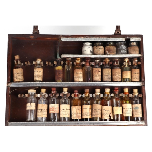 470 - A vintage travelling veterinarian's case with fitted interior containing various apothecary bottles ... 