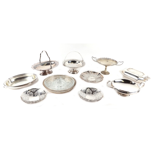 519 - A large quantity of silver plated items to include a wine coaster, bowls, dishes and flatware.