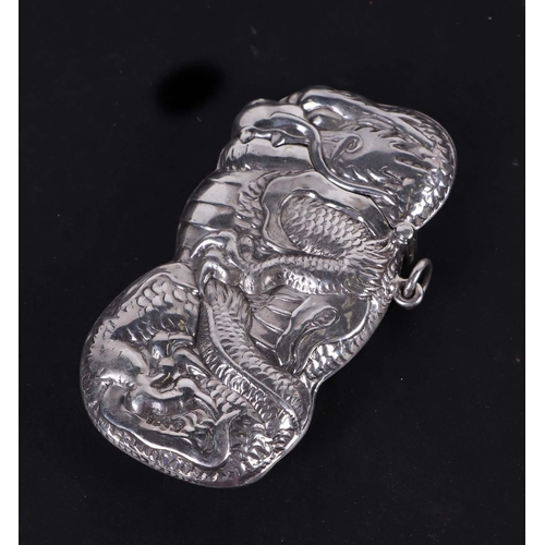 528 - A 925 silver vesta case in the form of a Chinese dragon, 7.5cms high, 34g.