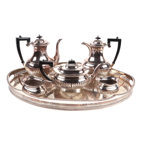 530 - A large quantity of silver plated items to include a spirit kettle on stand, tea sets, a large oval ... 