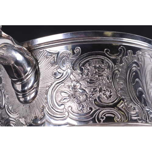 539 - A large heavy 18th century Irish silver twin-handled trophy cup with 'S' scroll handles, repousse fo... 