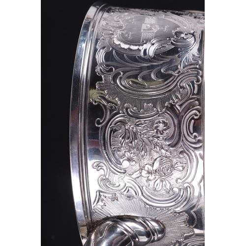 539 - A large heavy 18th century Irish silver twin-handled trophy cup with 'S' scroll handles, repousse fo... 