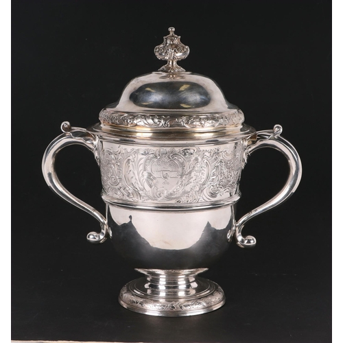 539 - A large heavy 18th century Irish silver twin-handled trophy cup with 'S' scroll handles, repousse fo... 