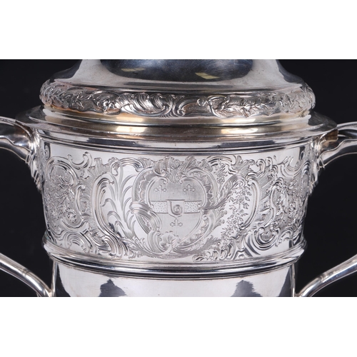 539 - A large heavy 18th century Irish silver twin-handled trophy cup with 'S' scroll handles, repousse fo... 