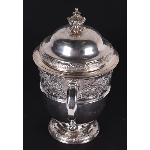 539 - A large heavy 18th century Irish silver twin-handled trophy cup with 'S' scroll handles, repousse fo... 