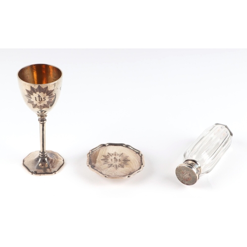 544 - An early Victorian silver communion set comprising chalice, paten and holy water bottle, London 1854... 