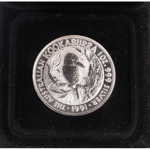 554 - A quantity of mixed British and foreign coins to include a Perth Mint Kookaburra silver coin and sil... 