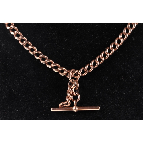 555 - A 9ct rose gold pocket watch chain with 'T' bar, 43cms long, 56.2g.