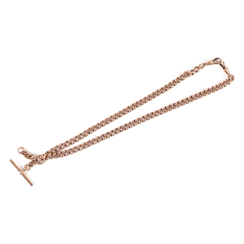 555 - A 9ct rose gold pocket watch chain with 'T' bar, 43cms long, 56.2g.