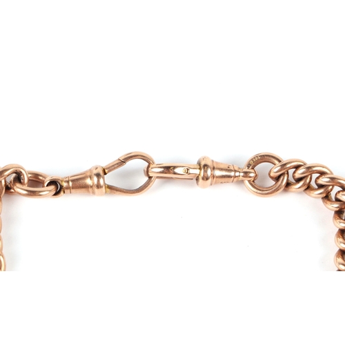 555 - A 9ct rose gold pocket watch chain with 'T' bar, 43cms long, 56.2g.