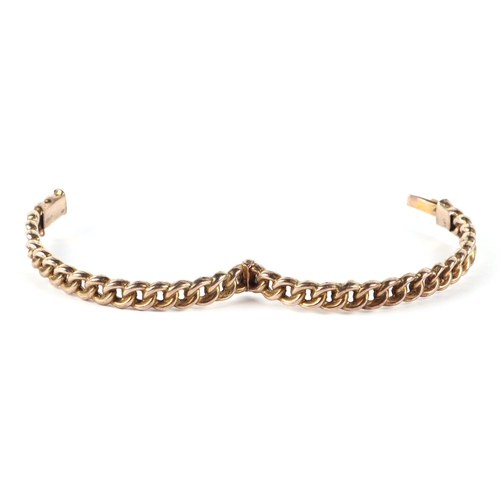 559 - A 9ct gold chain link hinged bangle, 12.3g.