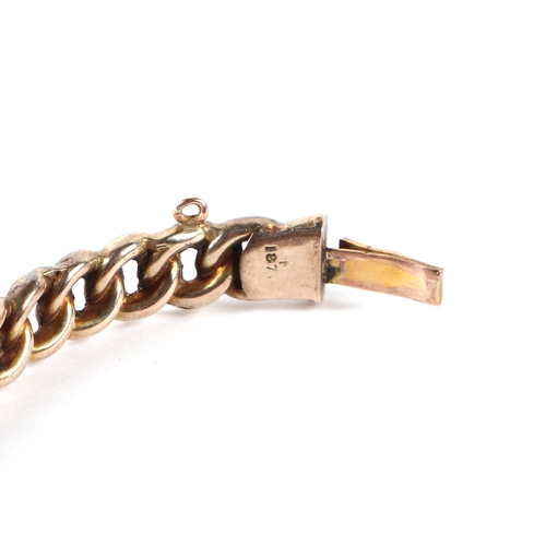 559 - A 9ct gold chain link hinged bangle, 12.3g.