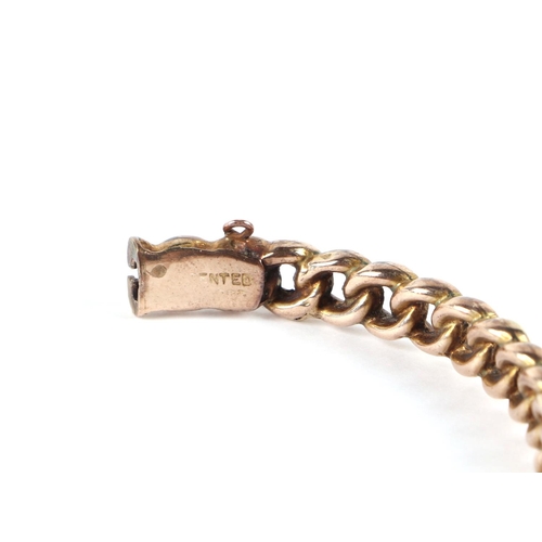 559 - A 9ct gold chain link hinged bangle, 12.3g.