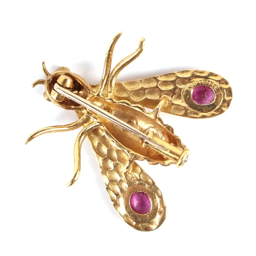 562 - An 18ct gold bee brooch by Chaumet (France), circa 1970, the body set with four diamonds, the wings ... 