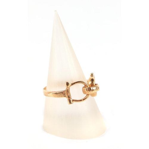 568 - Equestrian interest.  An 18ct gold stirrup ring, approx UK size N, 3.3g.