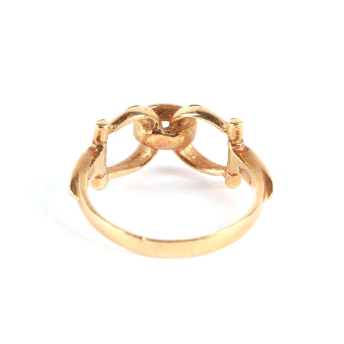 568 - Equestrian interest.  An 18ct gold stirrup ring, approx UK size N, 3.3g.