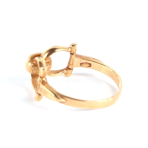 568 - Equestrian interest.  An 18ct gold stirrup ring, approx UK size N, 3.3g.