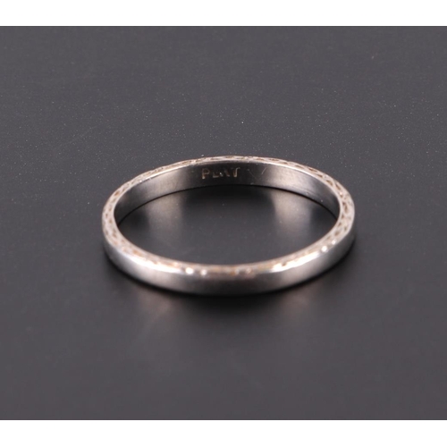 573 - A platinum wedding band, approx UK size P, 3.2g.