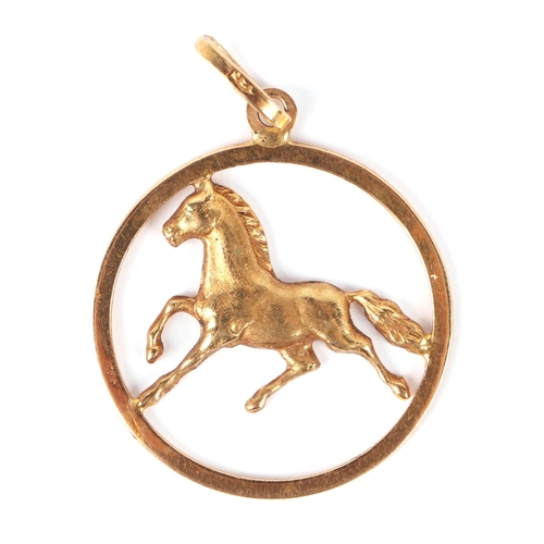 574 - A yellow metal pendant depicting a galloping horse, indistinct hallmark possibly for 18ct, 3.2g.; to... 