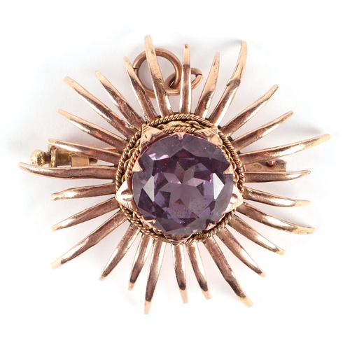 577 - An Egyptian gold (probably high carat) pendant brooch set with a large amethyst, 4cms diameter, 9.1g... 