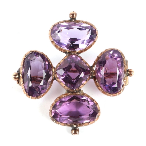 577 - An Egyptian gold (probably high carat) pendant brooch set with a large amethyst, 4cms diameter, 9.1g... 