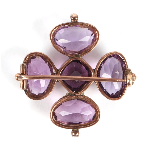 577 - An Egyptian gold (probably high carat) pendant brooch set with a large amethyst, 4cms diameter, 9.1g... 