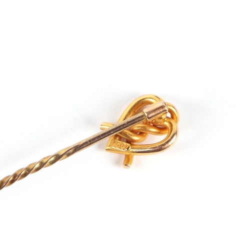 578 - A 15ct gold stick pin, 1.5g; together with a 9ct gold mounted pendant, 4.6g (2).