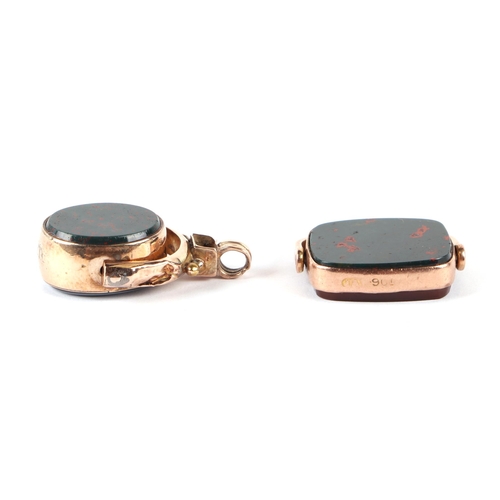 584 - Two gold mounted hardstone set swivel watch fobs (2).