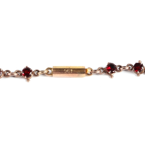 588 - A Victorian yellow metal mounted  garnet set necklace with 9ct gold clasp, 44cms long, 14.8g.