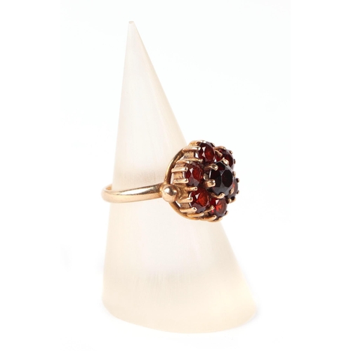 594 - A 9ct gold garnet cluster ring, approx UK size J, 3g.