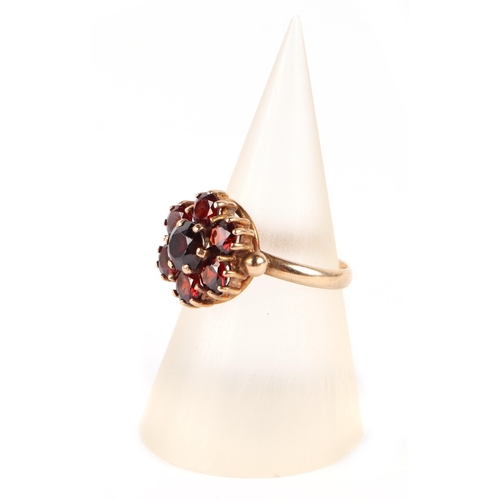 594 - A 9ct gold garnet cluster ring, approx UK size J, 3g.