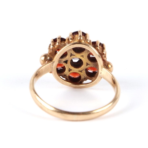 594 - A 9ct gold garnet cluster ring, approx UK size J, 3g.