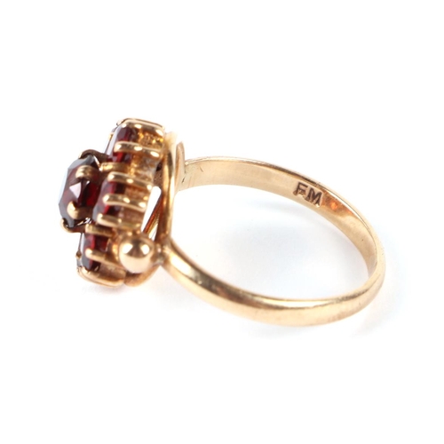 594 - A 9ct gold garnet cluster ring, approx UK size J, 3g.