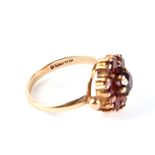 594 - A 9ct gold garnet cluster ring, approx UK size J, 3g.