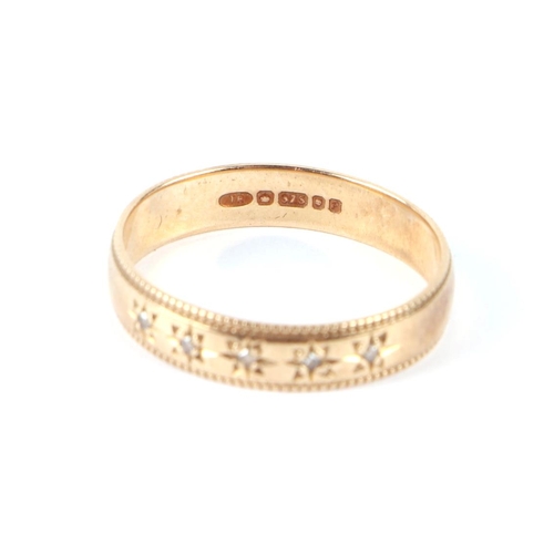 596 - A 9ct gold ring set with five small diamonds, approx UK size M, 1.9g.