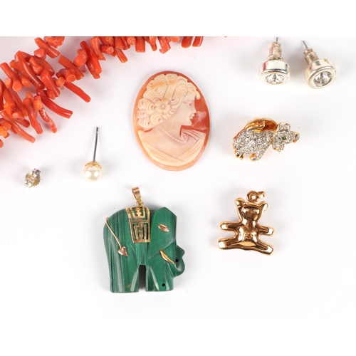 601 - A coral stick necklace; together with a malachite pendant in the form of an elephant, and other item... 